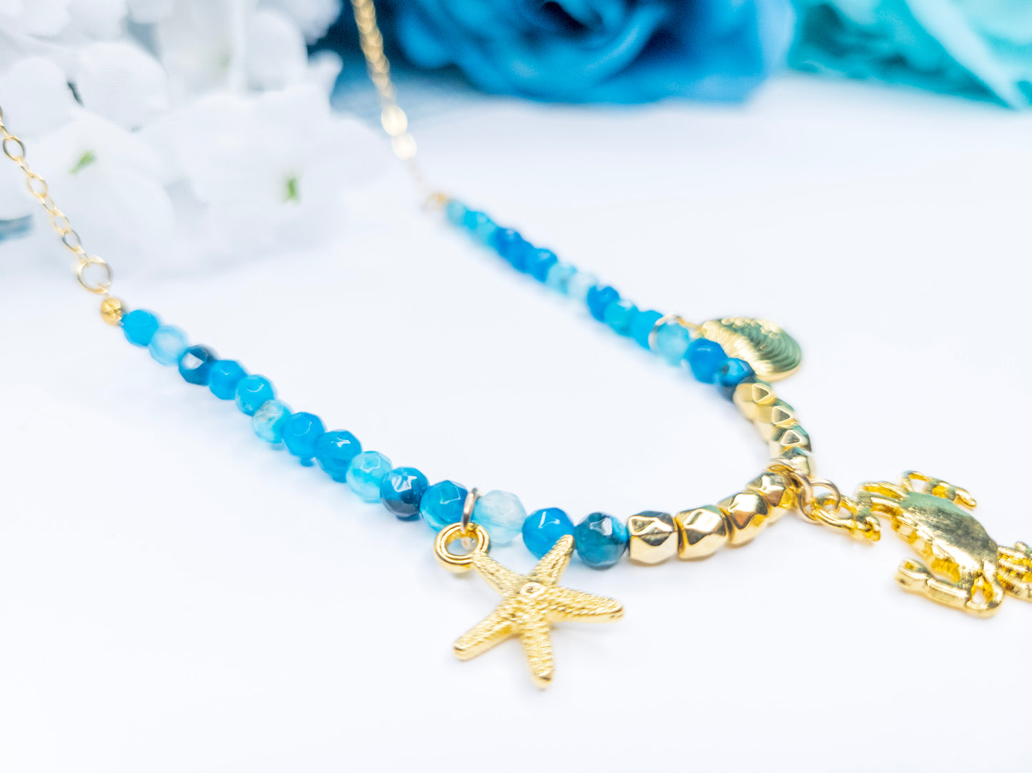 Blue necklace, starfish charm, crab charm, shell charm